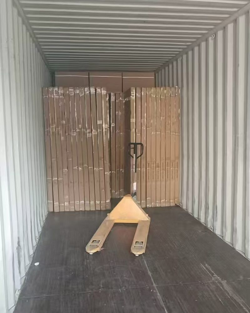 Container interior with a pallet jack during loading