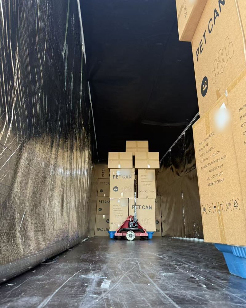 PET can cartons being stowed inside a trailer
