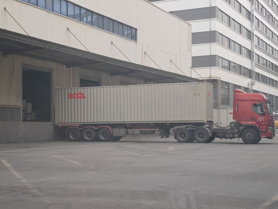Container loading at a warehouse dock